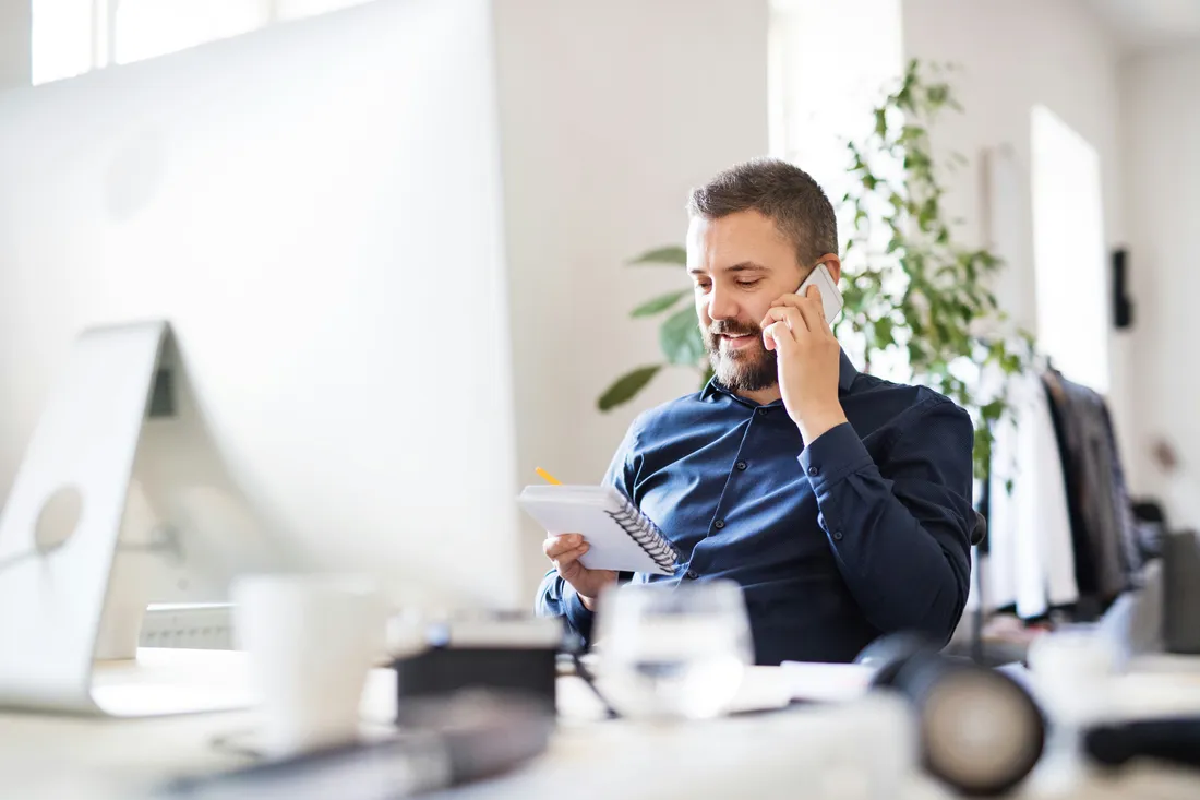 Business owner reviewing invoices and financial paperwork
