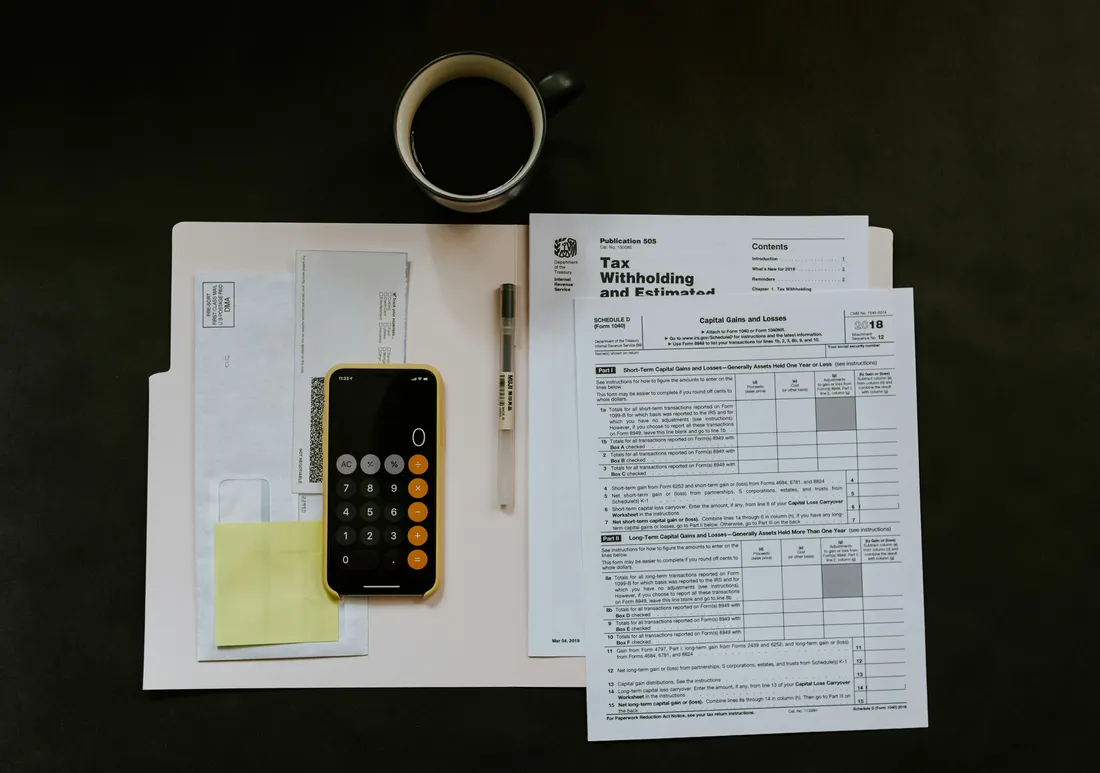 Canadian tax documents and calculator arranged on a desk