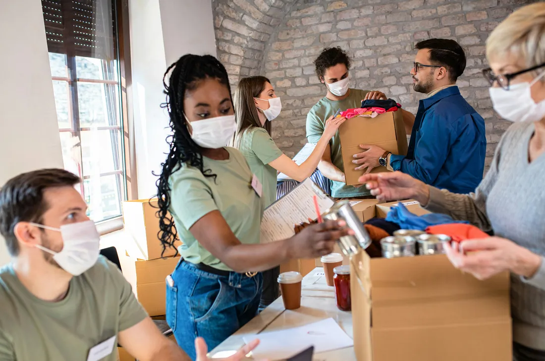Volunteers organizing donated items